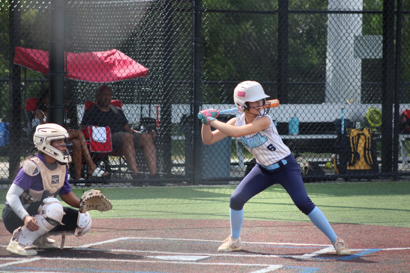 Avery Pratt playing softball
