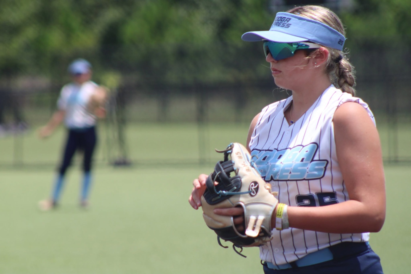 Braylyn Harmon playing softball