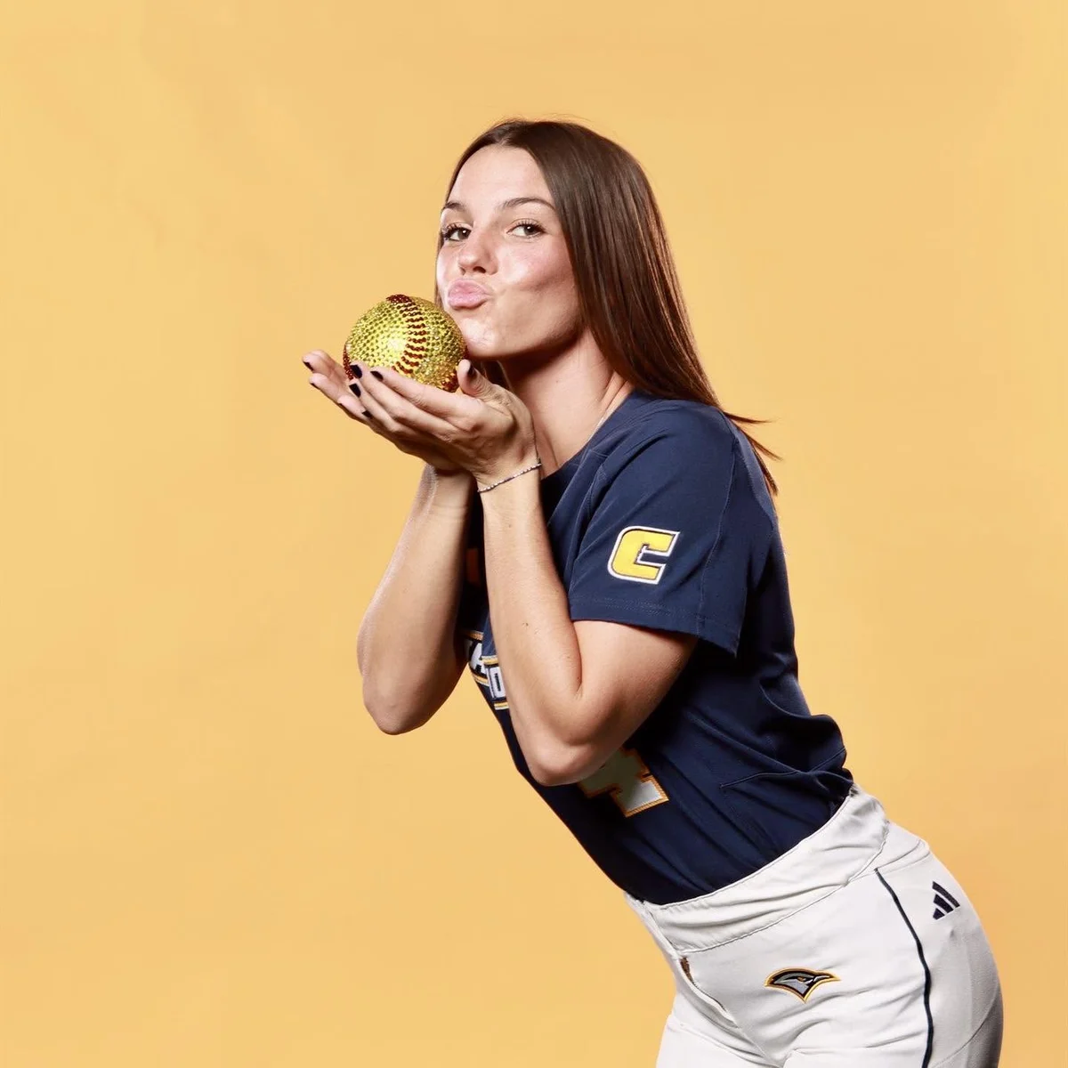 Raven Jones holding a softball